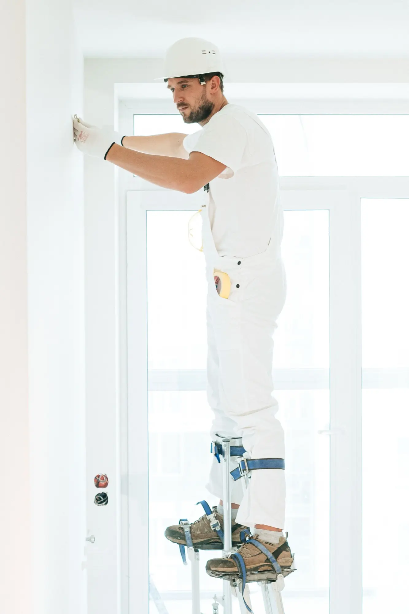Painting a high wall on stilts in a two-storey Kellyville home